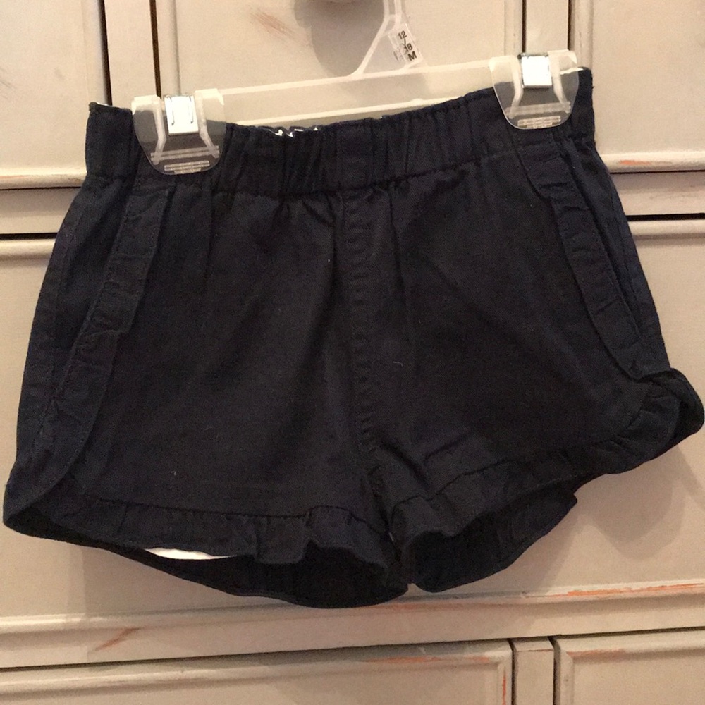 Girls navy colored shorts.  Never worn.
